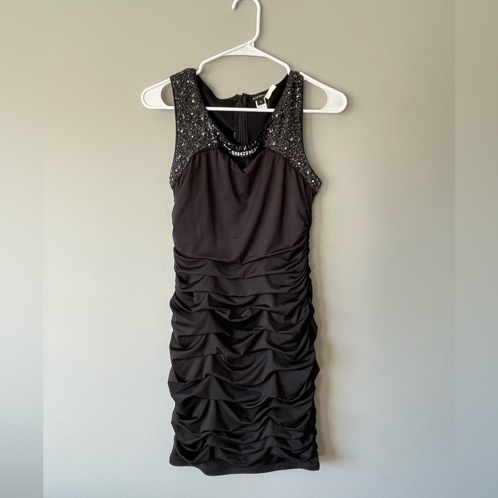 Boutique cocktail dress with cutout and embellishment